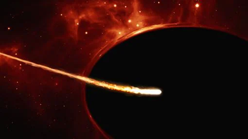 Representación de un evento de disrupción de marea, en el que una estrella es desgarrada al pasar por las cercanías de un agujero negro supermasivo
