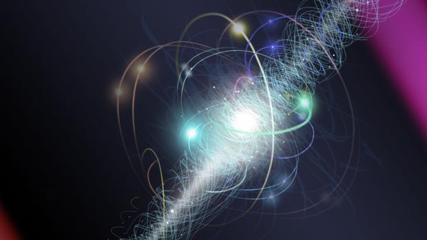 En esta representación artística, un electrón orbita el núcleo de un átomo, girando alrededor de su eje mientras una nube de otras partículas subatómicas se emiten y reabsorben constantemente